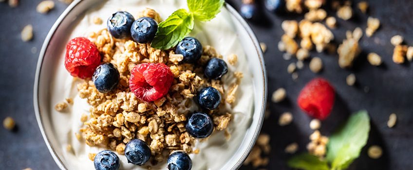 yogurt-bowl-with-muesli-raspberries-and-blueberries-a-healthy-breakfast-or-snack-rich-in-protein-fiber-and-calcium-healthy-diet-and-lifestyle-concept-