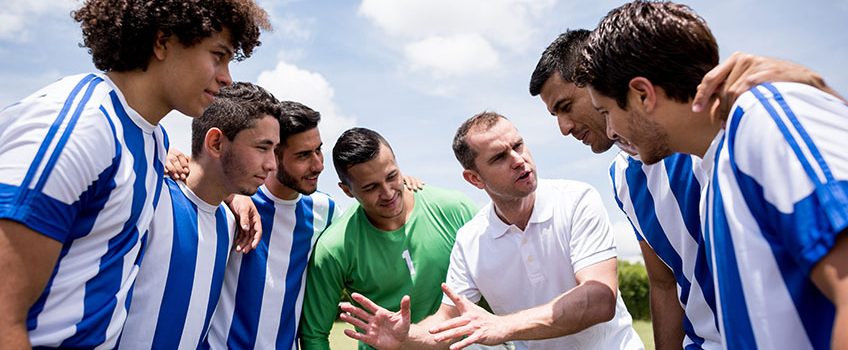 coach-talking-to-his-players-about-tactics-for-the-match